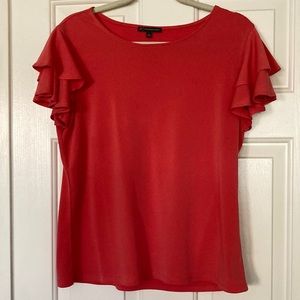 Nice top with flowy bell sleeves.  Size large. Coral color.